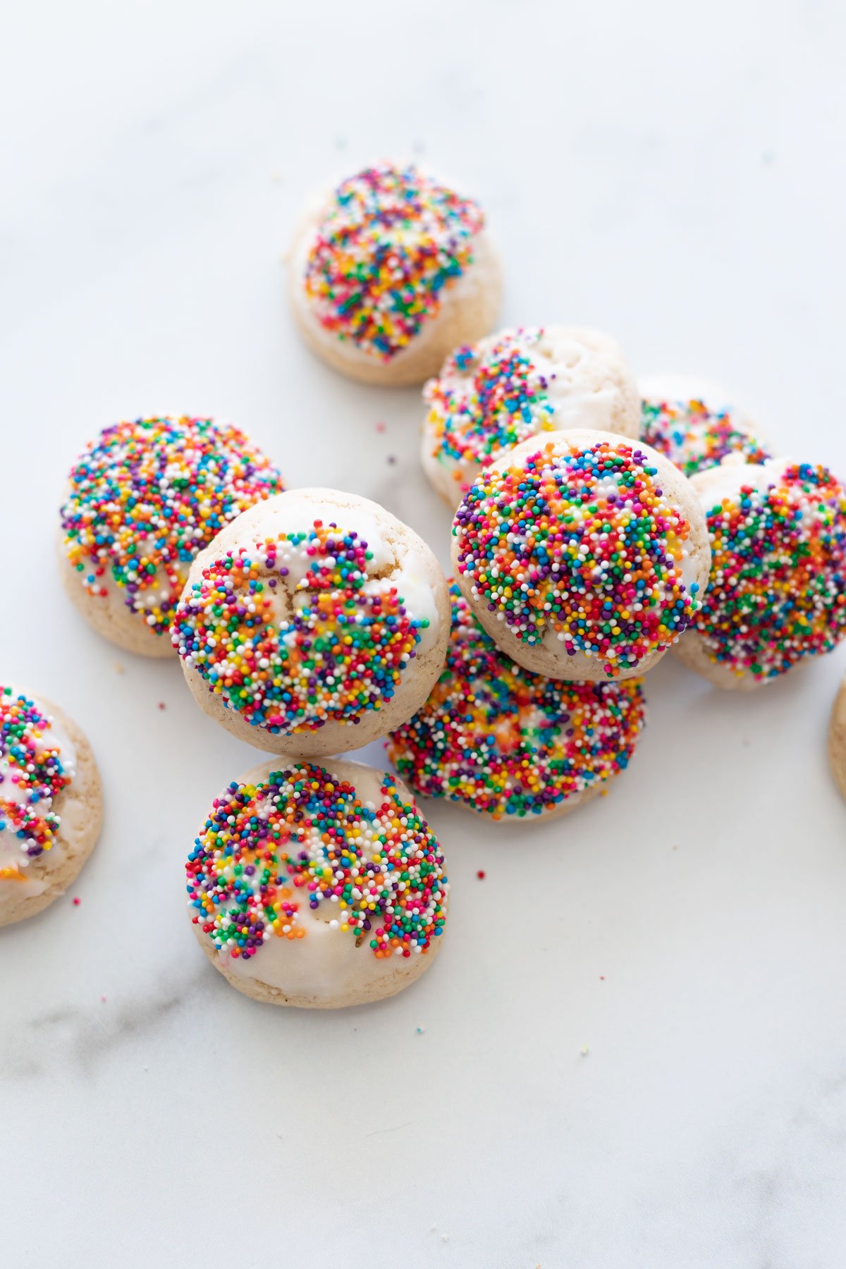 Top down view of anise cookies with sprinkles. 