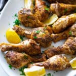 Chicken legs on a plate.