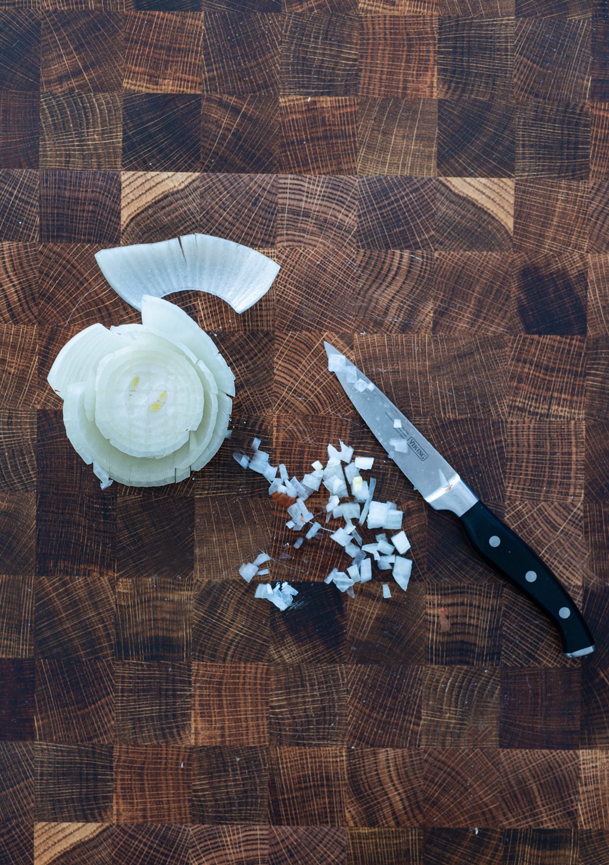 Person chopping onion.